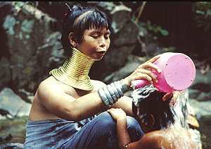 A Padaung Woman washes her child